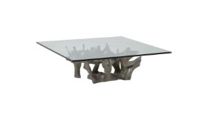 A MODERN GLASS TOPPED LOW CENTRE TABLE