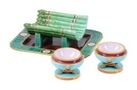 AN AESTHETIC MOVEMENT MINTON MAJOLICA ASPARAGUS SERVING DISH AND INTEGRAL STAND