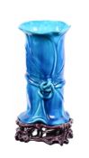 A MINTON MAJOLICA TURQUOISE GLAZED CHINOISERIE VASE ON TREFOIL STAND