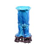 A MINTON MAJOLICA TURQUOISE GLAZED CHINOISERIE VASE ON TREFOIL STAND