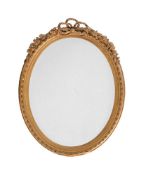 A VICTORIAN GILTWOOD AND COMPOSITION WALL MIRROR