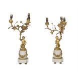 A PAIR OF FRENCH ORMOLU AND WHITE MARBLE THREE-LIGHT CANDELABRA