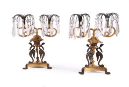 A PAIR OF REGENCY GILT AND PATINATED BRONZE TWIN-LIGHT TABLE LUSTRES