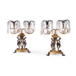 A PAIR OF REGENCY GILT AND PATINATED BRONZE TWIN-LIGHT TABLE LUSTRES