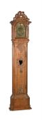 A CONTINENTAL CARVED OAK LONGCASE CLOCK