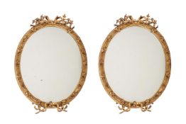 A PAIR OF VICTORIAN GILTWOOD AND COMPOSITION WALL MIRRORS