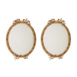 A PAIR OF VICTORIAN GILTWOOD AND COMPOSITION WALL MIRRORS