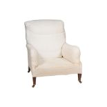 A VICTORIAN WALNUT AND WHITE CALICO UPHOLSTERED ARMCHAIR