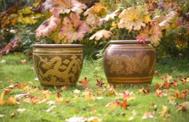 TWO SLIP GLAZED RED POTTERY GARDEN PLANTERS IN CHINESE TASTE