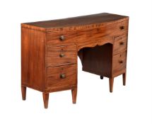 A REGENCY MAHOGANY AND LINE INLAID BOWFRONT DRESSING TABLE