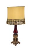A VICTORIAN RUBY GLASS AND GILT-METAL-MOUNTED COLULMNAR LAMP-BASE