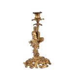 A FRENCH GILT BRONZE FIGURAL CANDLESTICK AFTER CORNEILLE VAN CLEVE (1645-1732)