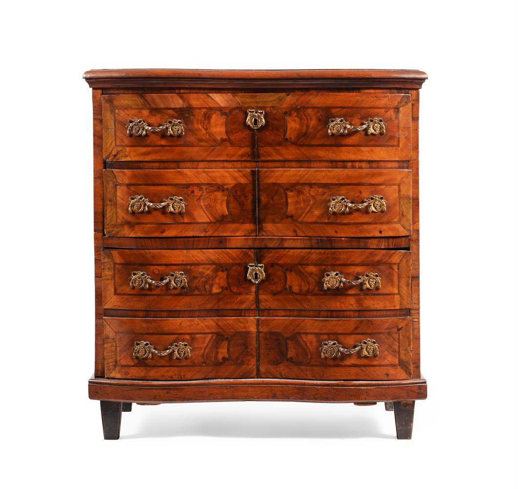 A CONTINENTAL FIGURED WALNUT AND INLAID CHEST OF DRAWERS, POSSIBLY ITALIAN OR SOUTH GERMAN