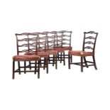 A HARLEQUIN SET OF NINE MAHOGANY LADDER-BACK DINING CHAIRS