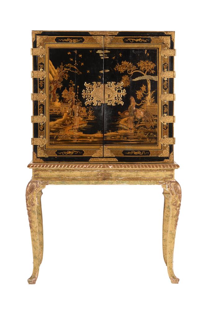 A BLACK AND GILT CHINOISERIE CABINET ON STAND