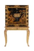 A BLACK AND GILT CHINOISERIE CABINET ON STAND