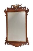 A MAHOGANY AND PARCEL GILT FRET FRAME WALL MIRRORIN GEORGE II STYLE