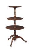 A MAHOGANY THREE TIERED DUMB WAITER IN GEORGE III STYLE