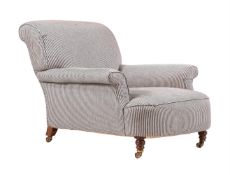 A WALNUT AND UPHOLSTERED ARMCHAIR