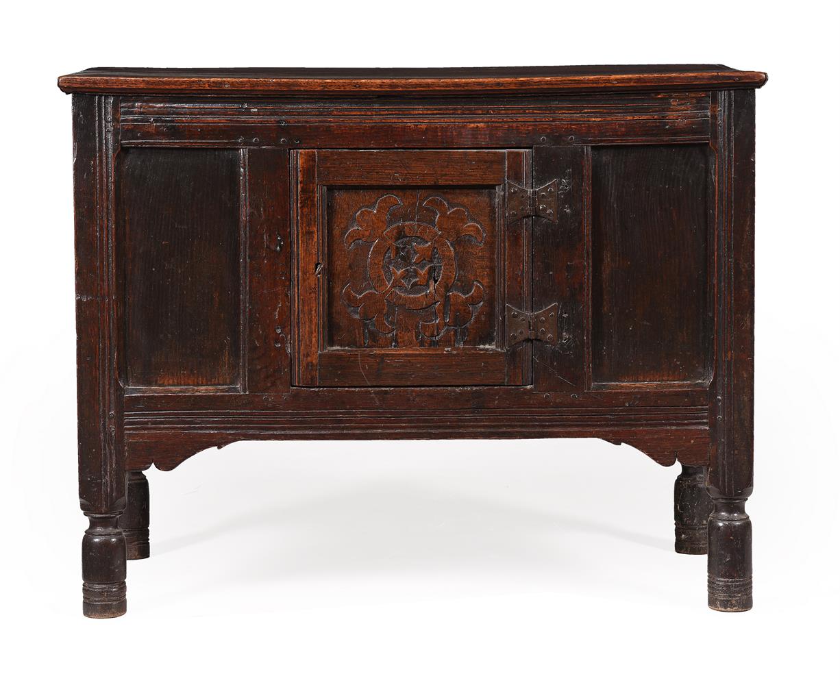 A CARVED OAK COFFER