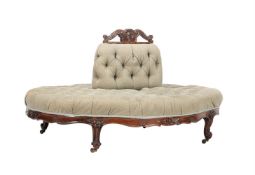 A VICTORIAN WALNUT AND UPHOLSTERED CONVERSATION SOFA OF OVULAR FORMCIRCA 1860The central bolster w
