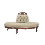 A VICTORIAN WALNUT AND UPHOLSTERED CONVERSATION SOFA OF OVULAR FORMCIRCA 1860The central bolster w