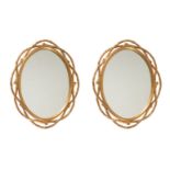 A PAIR OF GILTWOOD OVAL WALL MIRROR