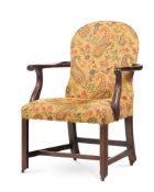 A MAHOGANY AND UPHOLSTERED ARMCHAIR