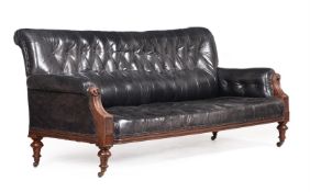 A VICTORIAN WALNUT AND BLACK LEATHER UPHOLSTERED SOFA