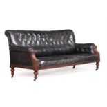 A VICTORIAN WALNUT AND BLACK LEATHER UPHOLSTERED SOFA