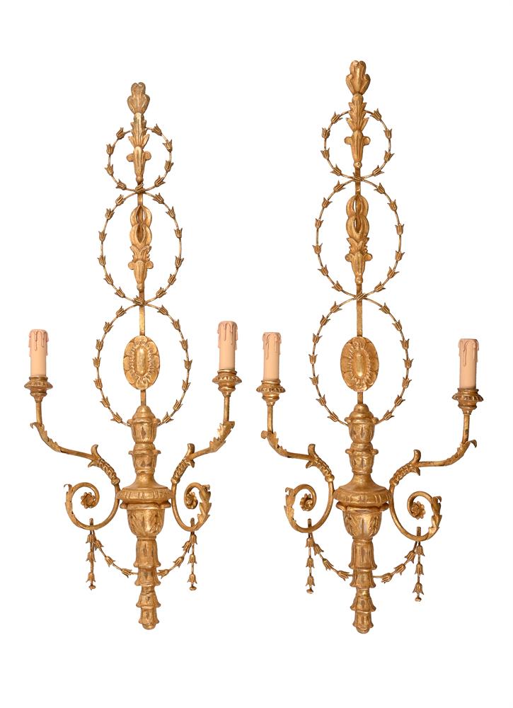 A PAIR OF GILT COMPOSITION WALL LIGHTS IN 18TH CENTURY TASTE