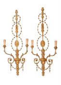 A PAIR OF GILT COMPOSITION WALL LIGHTS IN 18TH CENTURY TASTE