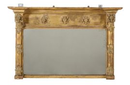 A GILTWOOD AND COMPOSITION OVERMANTLE WALL MIRROR