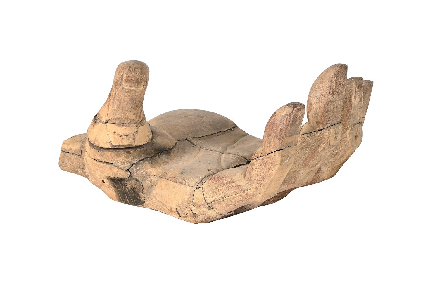 A LARGE CARVED HARDWOOD BUDDHA'S HAND