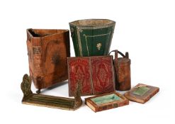 AN ASSORTMENT OF LEATHER CLAD LIBRARY ITEMS