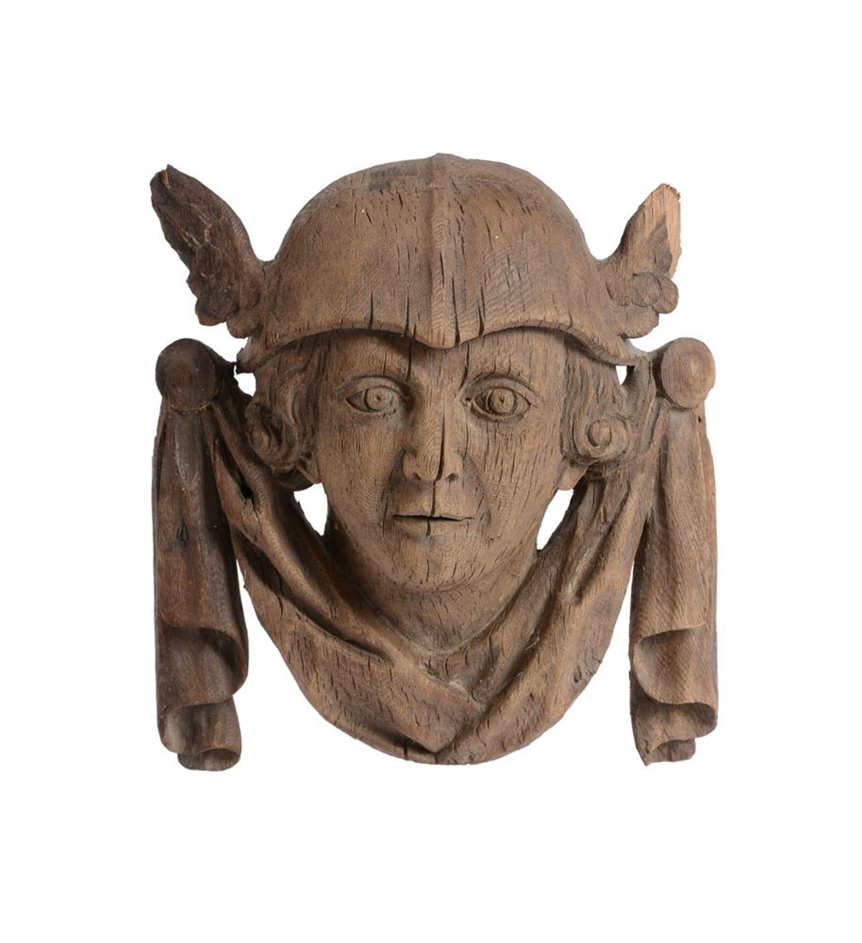 A CARVED OAK MASK WALL MOUNT