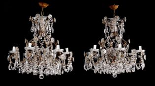 A PAIR OF ITALIAN IRON AND GLASS MOUNTED SIX LIGHT CHANDELIERS