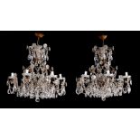 A PAIR OF ITALIAN IRON AND GLASS MOUNTED SIX LIGHT CHANDELIERS