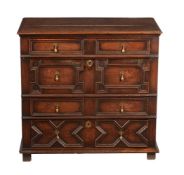 A CHARLES II OAK CHEST OF DRAWERS