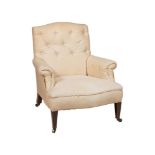 A VICTORIAN WALNUT AND WHITE CALICO UPHOLSTERED ARMCHAIR IN HOWARD & SONS STYLE