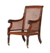 A MAHOGANY BERGERE ARMCHAIR IN REGENCY STYLE