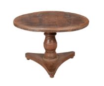 AN ANGLO-INDIAN HARDWOOD CIRCULAR CENTRE OR DINING TABLE