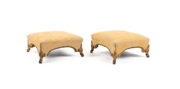 A PAIR OF YELLOW UPHOLSTERED FOOTSTOOLS IN REGENCY STYLE