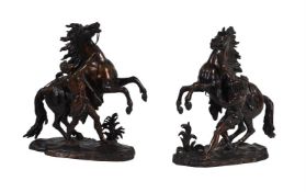 AFTER COUSTOU, A LARGE PAIR OF BRONZE MARLY HORSES