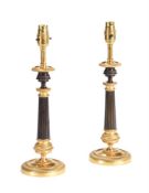 A PAIR OF BRONZE AND GILT METAL TABLE LAMPS