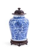 A CHINESE TRANSITIONAL BLUE AND WHITE BALUSTER VASE, CIRCA 1700