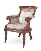 A GEORGE IV MAHOGANY LIBRARY BERGÈRE ARMCHAIR, ATTRIBUTED TO GILLOWS, CIRCA 1825