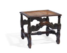 A CARVED OAK AND CANED STOOL, LATE 17TH CENTURY AND LATER