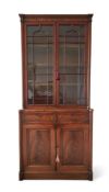 A GEORGE IV MAHOGANY BOOKCASE, IN THE MANNER OF GILLOWS, CIRCA 1825