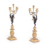 A PAIR OF EMPIRE BRONZE AND GILT METAL FIGURAL TWIN-LIGHT CANDELABRA, EARLY 19TH CENTURY